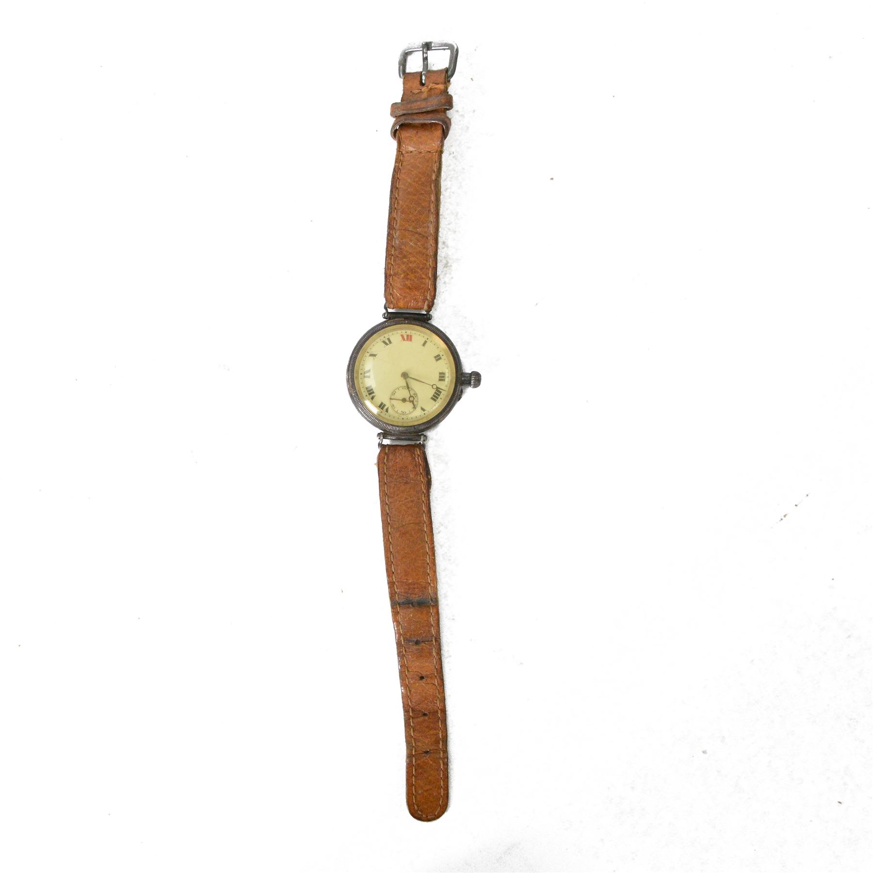 Silver cased trench watch enamel dial with Roman numerals, red XII, Longines movement, used in the Boer war, inscribed to the back 'E M Everitt From W.E Everitt 1882' 