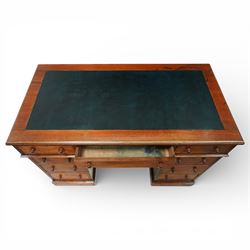 Victorian mahogany pedestal desk, rectangular moulded top inset with green leather writing surface with gilt tooling, fitted with three frieze drawers above opposing pedestals each fitted with three drawers, all with turned wooden knob handles, plinth bases
