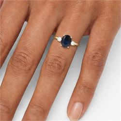 18ct gold sapphire and diamond three stone ring, single oval sapphire of approx 2.20 carat, with a single round brilliant cut diamond set either side, hallmarked, total diamond weight approx 0.25 carat