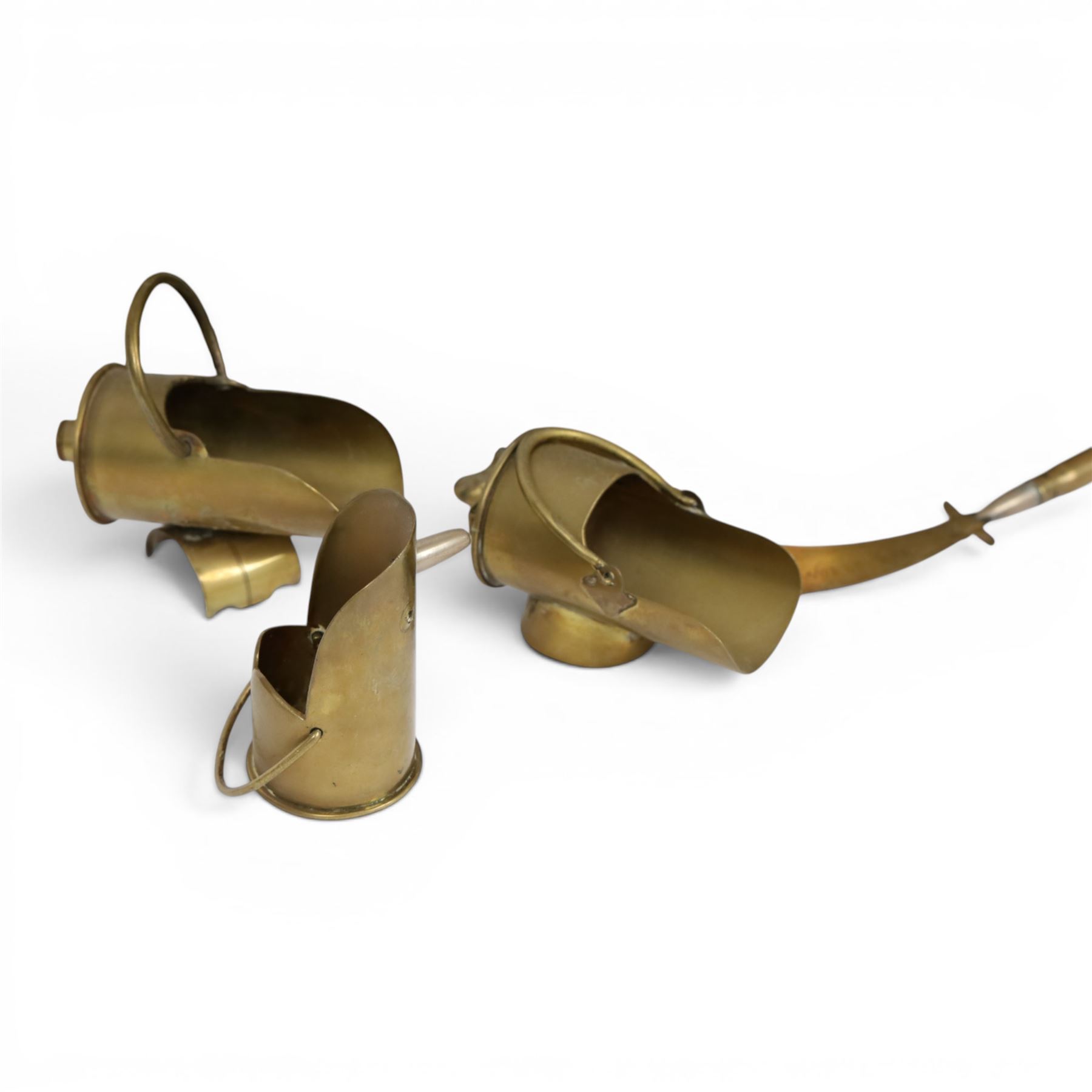 Trench Art shell case jardiniere, with pierced rim and paw feet, Jug marked The British General Hospital  January 1918 April 1919, seven miniature coal buckets and a sword   