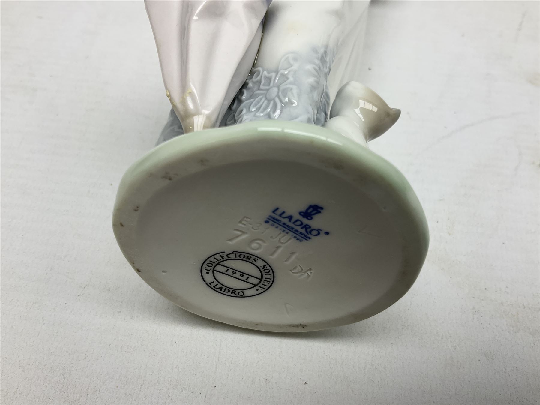 Three Lladro figures, comprising Garden Classic, signed no 7617, Summer Stroll no 7611 and Best Friend no 7620, all with original boxes, largest example H24cm 