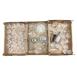 Quantity of glass to include drinking glasses, decanters, claret jug, bowls, ship bottle on wood stand etc in three boxes
