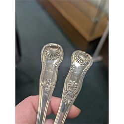 Seven silver Kings/Queens pattern dessert spoons, including George III Irish silver pair with engraved griffin crests, hallmarked Dublin 1818, maker's mark SI and five with varying dates and makers, all hallmarked 