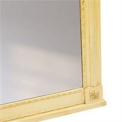 Traditional design cream painted overmantle mirror, projecting cornice with applied foliate detail, bevelled glass plate 