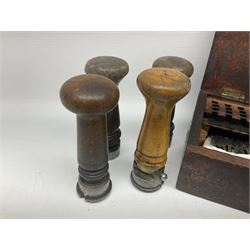 Two Post Office hand stamps 'Heversham Milnthorpe Cumbria' and 'Cimla Neath', together with two hand stamp bodies and various date numbers, housed in a fitted box