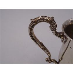 1930s silver Christening mug, of plain waisted form, with acanthus capped scroll handle, upon stepped circular foot, hallmarked Barker Brothers Silver Ltd, Birmingham 1933, including handle H10cm 