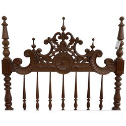 Pair of Spanish carved hardwood headboards, the pediment carved and pierced with shell C-scrolls and carved foliage, turned spindle back, on turned supports 
