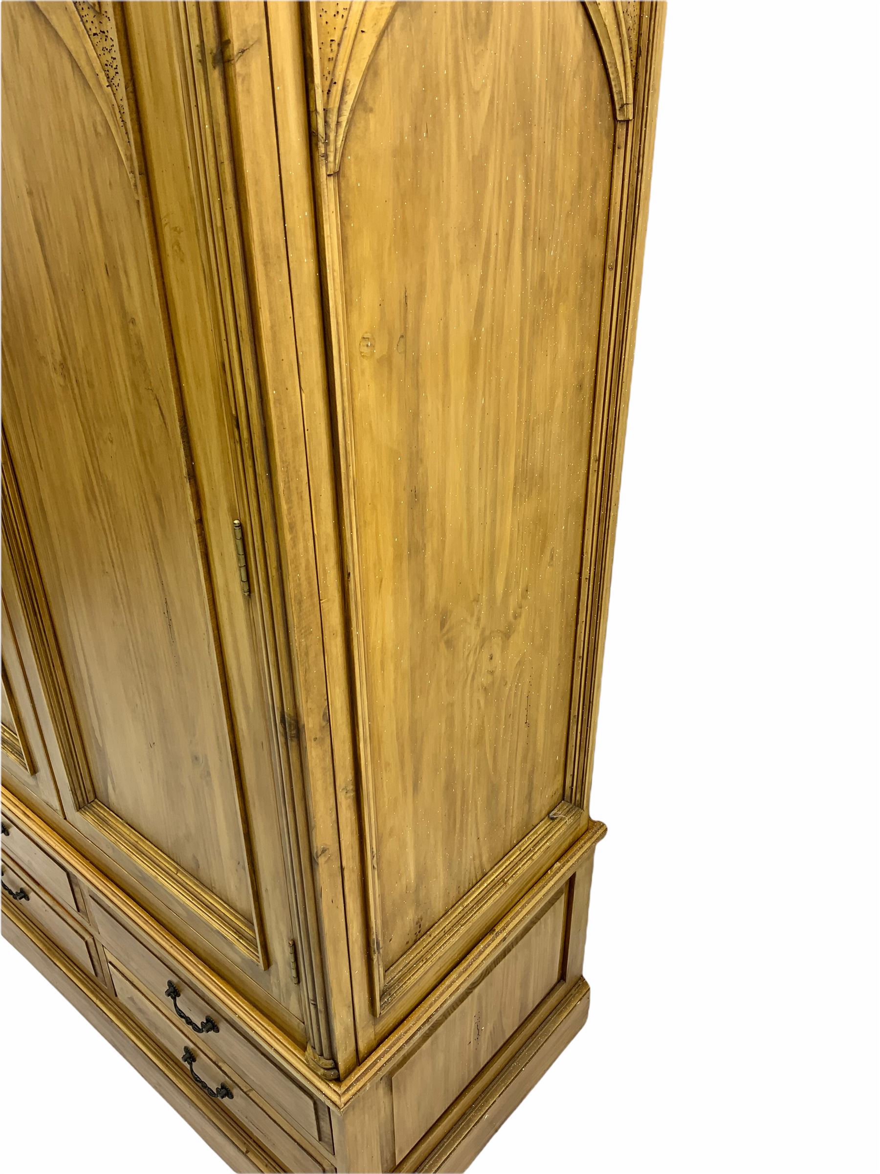 Gothic polished pine double wardrobe, fitted with four drawers