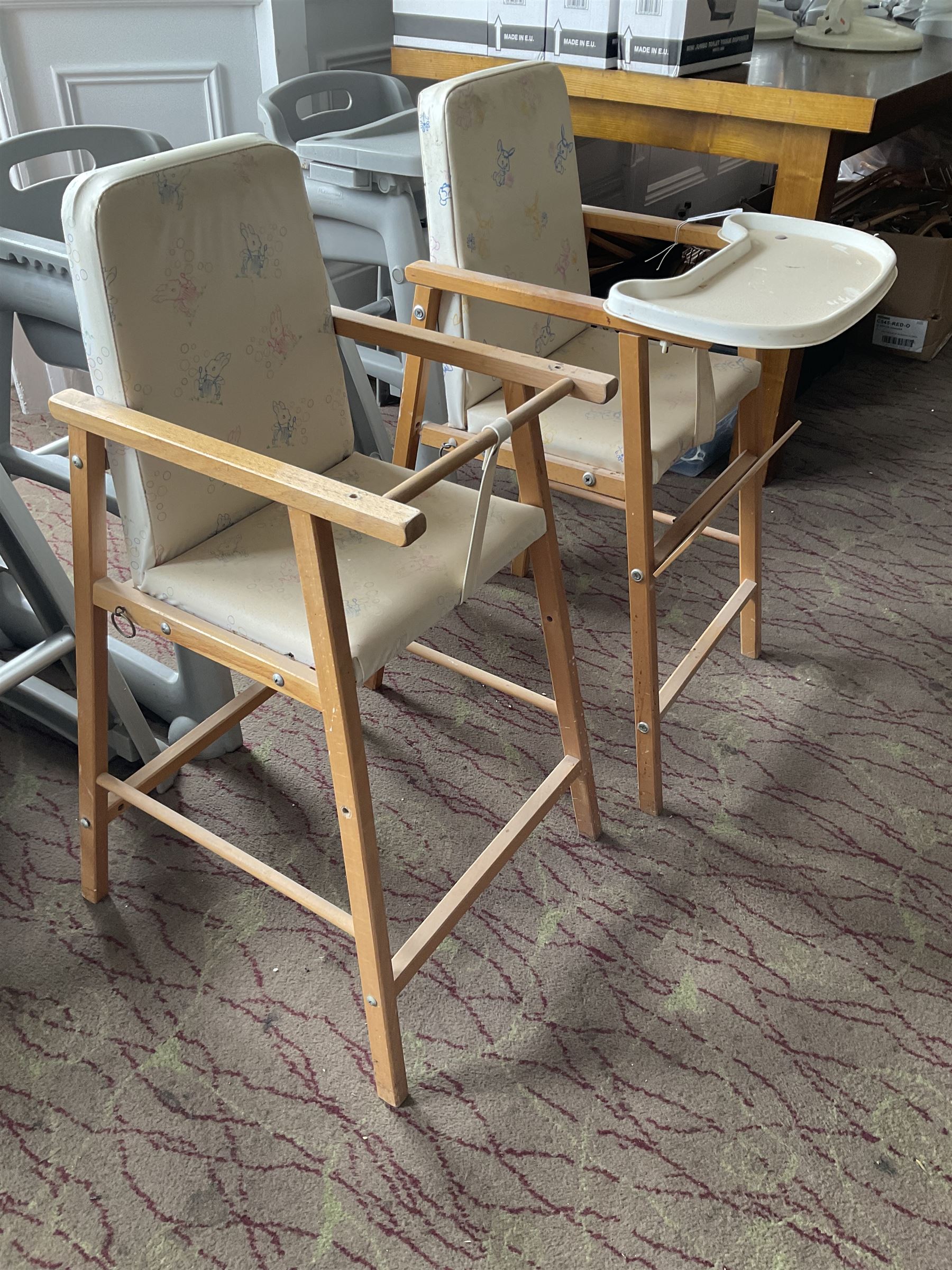 Set of three plastic and a pair of wooden baby high chairs with additional saddle stools (9)- LOT SUBJECT TO VAT ON THE HAMMER PRICE - To be collected by appointment from The Ambassador Hotel, 36-38 Esplanade, Scarborough YO11 2AY. ALL GOODS MUST BE REMOVED BY WEDNESDAY 15TH JUNE.