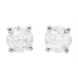 Pair of 18ct white gold diamond earrings, each stud set with a round brilliant cut diamond...