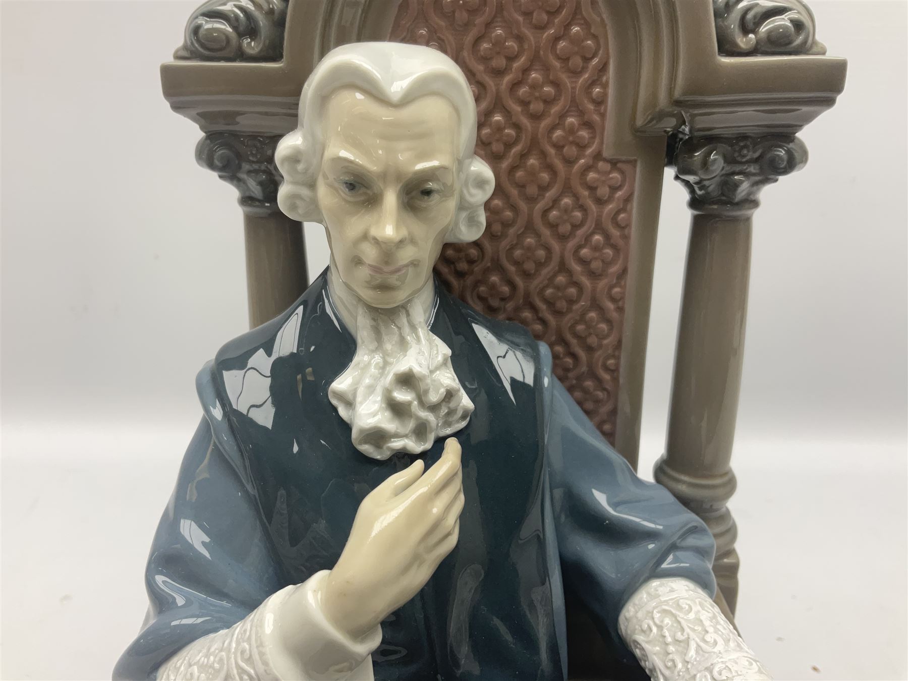 Lladro figure, Justice, modelled as a judge sat in a char, sculpted by Salvador Furió, with original box, no 5489, year issued 1988, year retired 1993, H34cm 