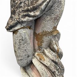 Two composition stone garden figures, comprising a seated boy figure and a standing classical draped female figure, each on square base, weathered painted finish.