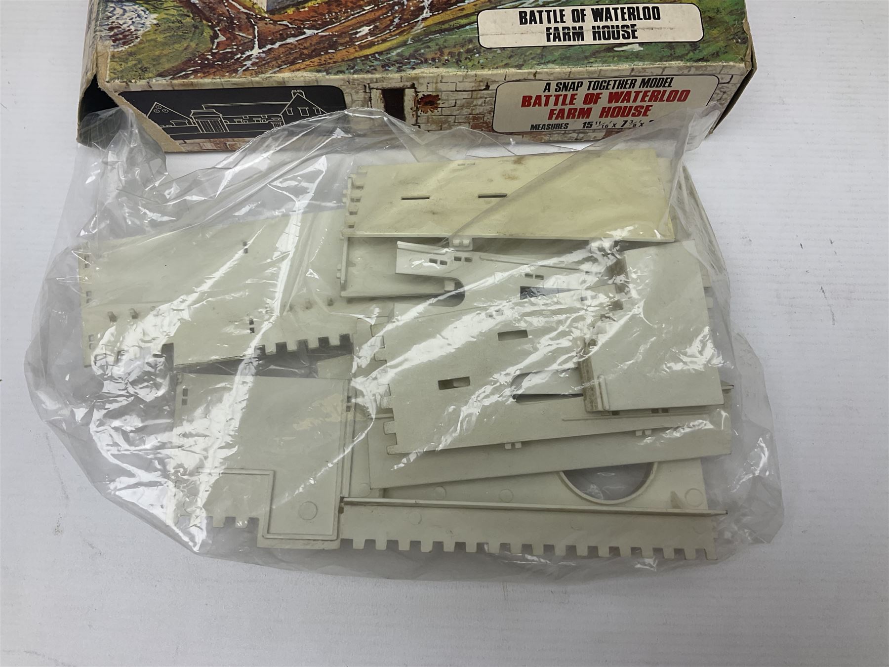 Three unmade construction kits - Airfix 1:24 scale Supermarine Spitfire Mk.1A; predominantly in unopened factory packaging with instructions and decal sheet; Frog Shell Welder with instructions; and Airfix Battle of Waterloo Farmhouse (instructions on box base); all boxed (3)