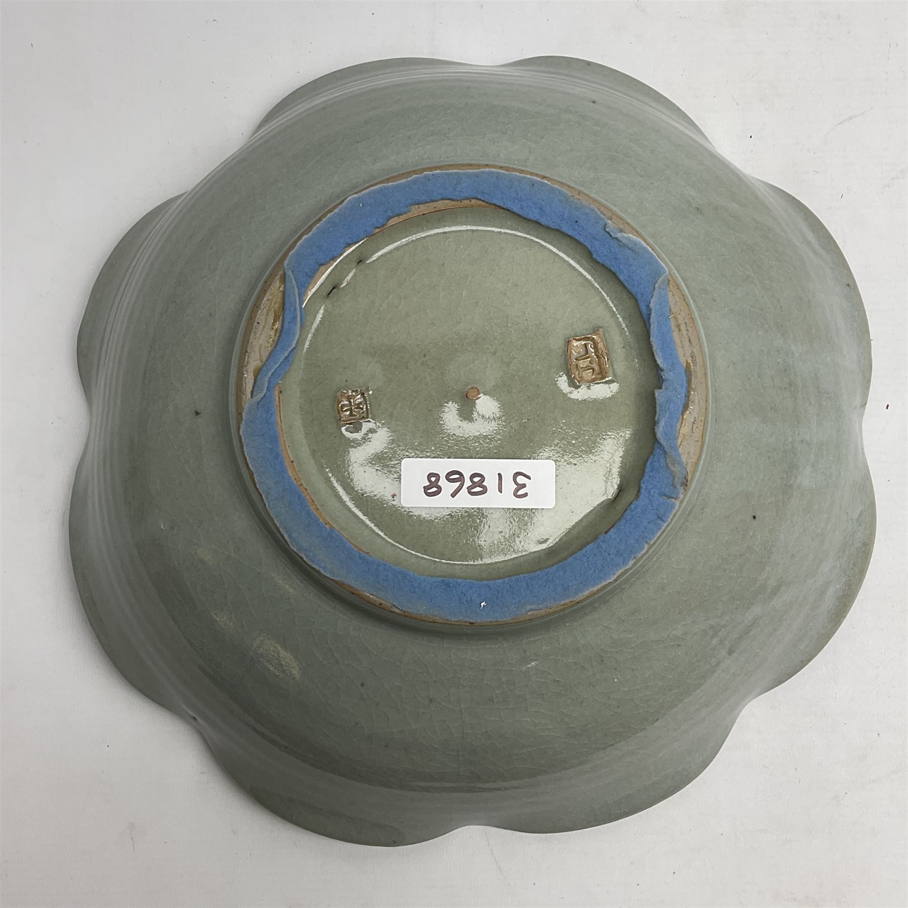 Jeremy Leach (British 1941-): Celadon glazed stoneware bowl of fluted circular form, with impressed mark beneath, D35cm