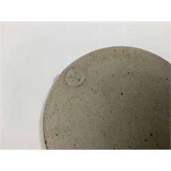 Michael Leach (British 1913-1985) for Yelland pottery; two large glazed stoneware plates with dark brown stylised decoration upon oatmeal ground, together with a jug in merging blue, green and brown, all with impressed marks beneath, largest plate D37cm