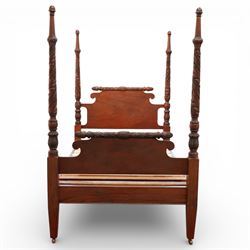 Early 19th century Regency carved mahogany four poster double bed, 4'6, the shaped headboard and footboard each surmounted by a finely carved pinecone and foliate moulded rail, flanked by ring turned and boldly spiral carved tapering posts with acorn finials, raised on square section legs, with slatted base