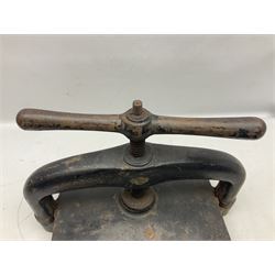 Victorian cast iron book press, with central screw thread and baton handle, L48cm, D26cm