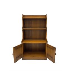 Ercol - medium elm bookcase fitted with two cupboards