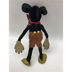 Deans Rag Book Mickey Mouse soft toy, circa 1930's, black velveteen head and body, with cream face and hands, red shorts and yellow felt shoes, marked Reg. No. 750811 to neck H19cm