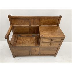 'Acornman' figured oak telephone table, panelled back above hinged seat and two drawers, panelled sides and front, all over adzing, by Alan Grainger of Brandsby, York