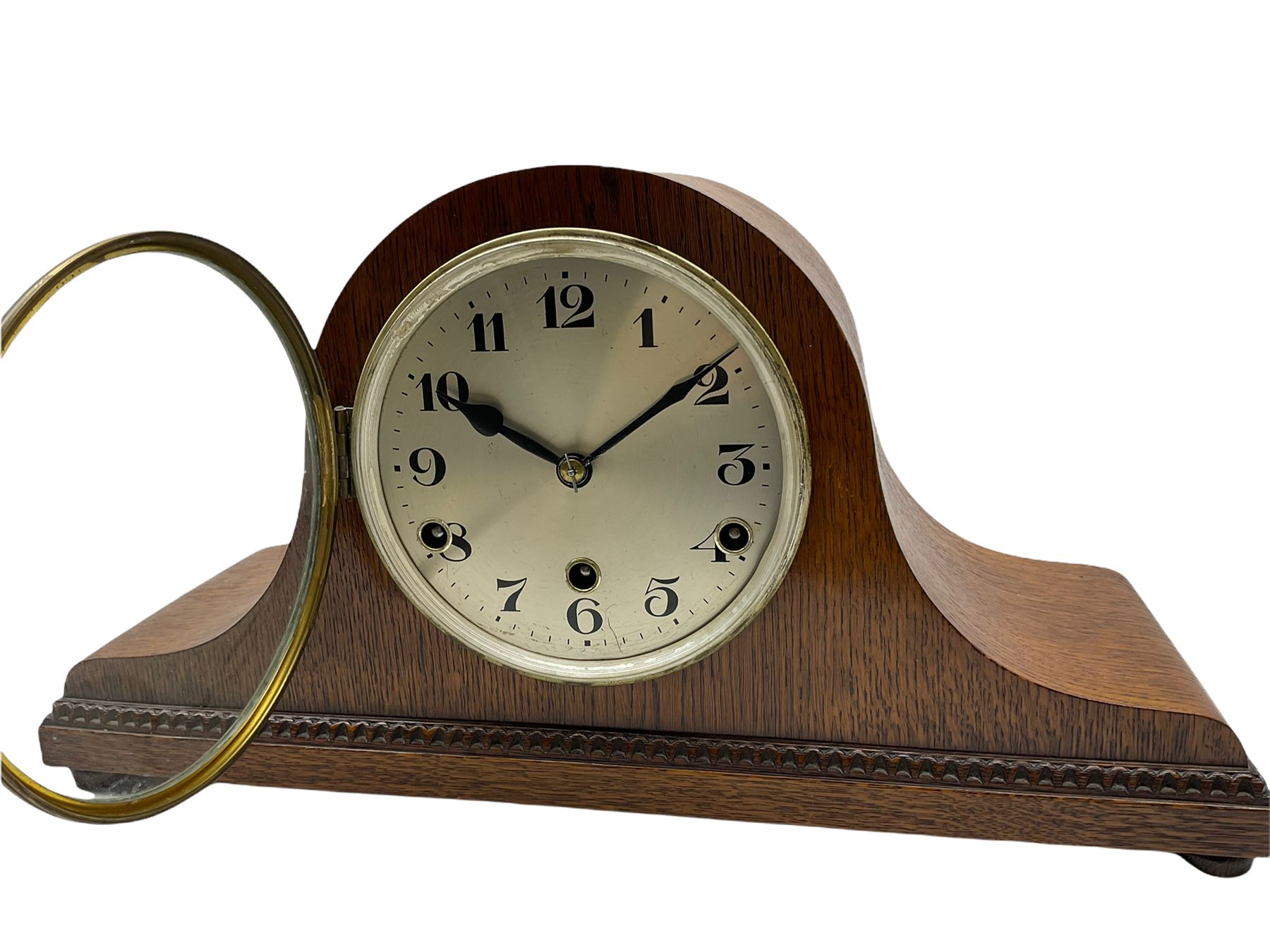 A light oak cased Tambour clock with a German 8-day movement sounding the quarters and hours on gong rods, with a 6” silvered dial , Arabic numerals and minute track, steel spade hands within a spun brass bezel and convex glass.
With pendulum. 








