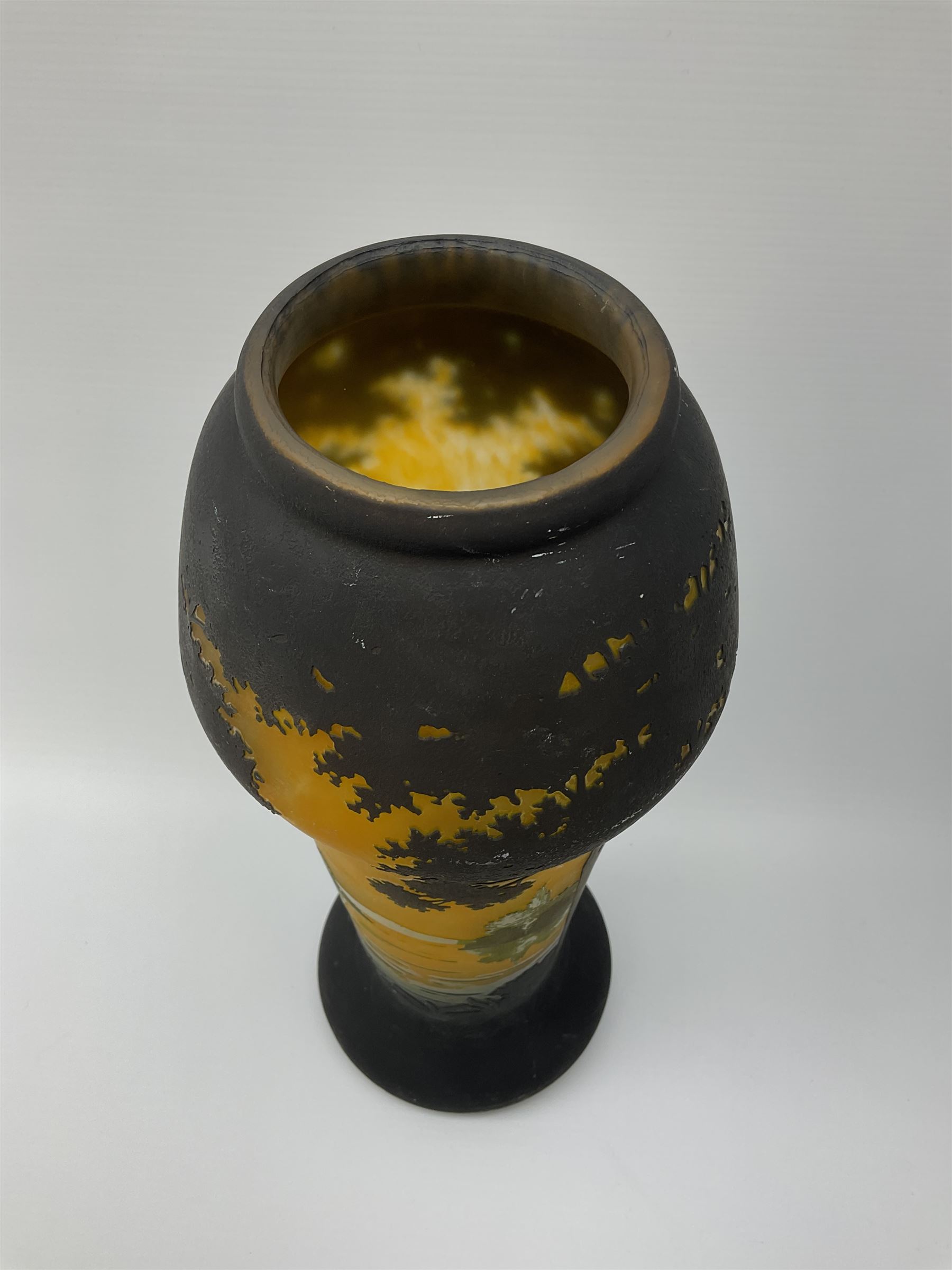 Reproduction Daum Nancy art nouveau style overlay and cut glass vase  decorated with woodland and a lake scene on a yellow ground, H35cm. 