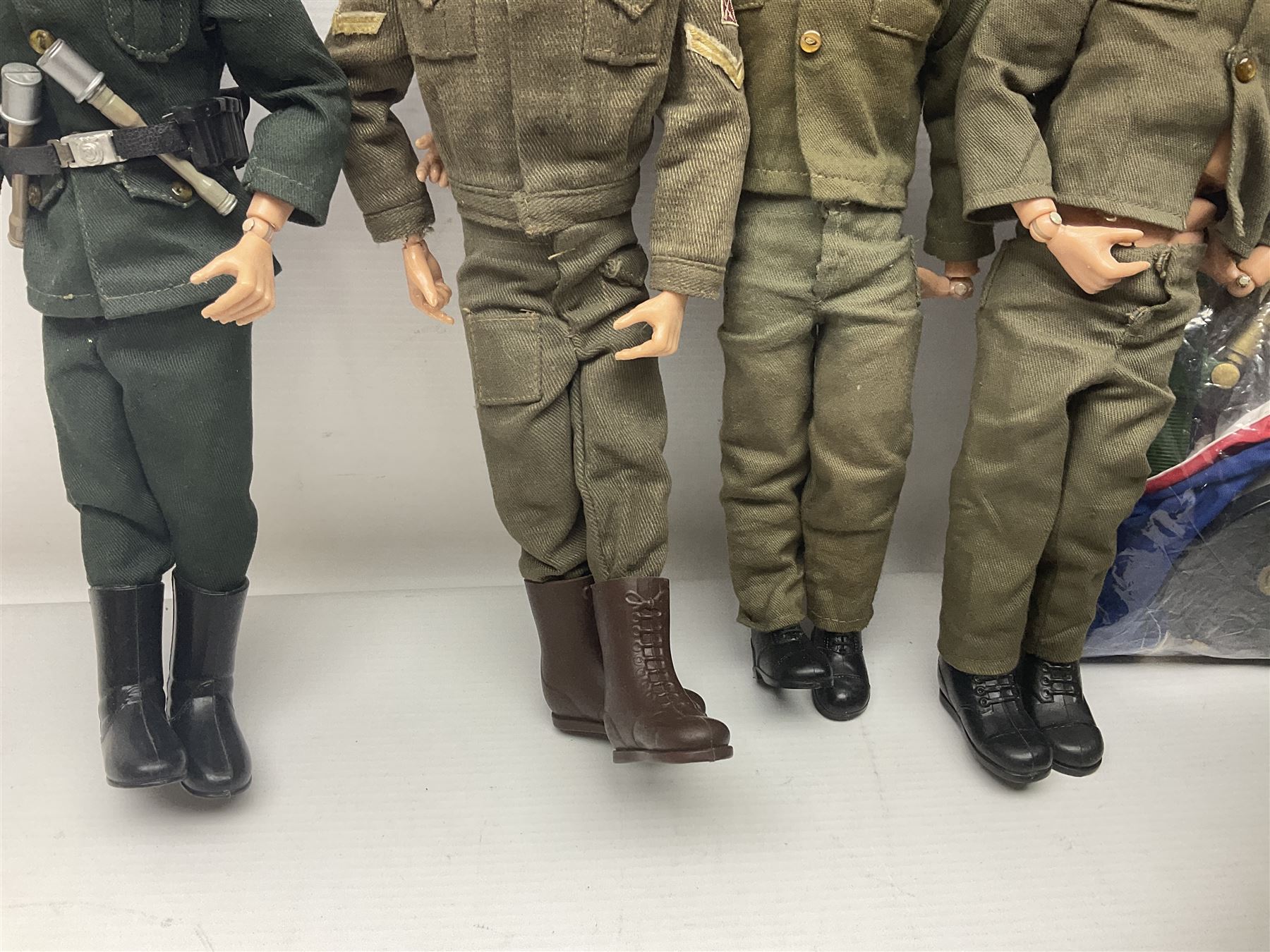 Action Man - five figures marked on the back 'Made in England by Palitoy under licence from Hasbro 1964', one dressed as a German Stormtrooper, one as a Red Devil Pilot and three in army uniform; another similar action figure marked to the right buttock ' G.I. Joe Copyright 1964 by Hasbro Patent Pending Made in Canada' dressed in army uniform; together with an Action Man jeep, field gun, mortar and machine guns and other accessories including helmets and weapons, parachute, diving equipment, skis and snow shoes, boots, uniforms etc; all unboxed