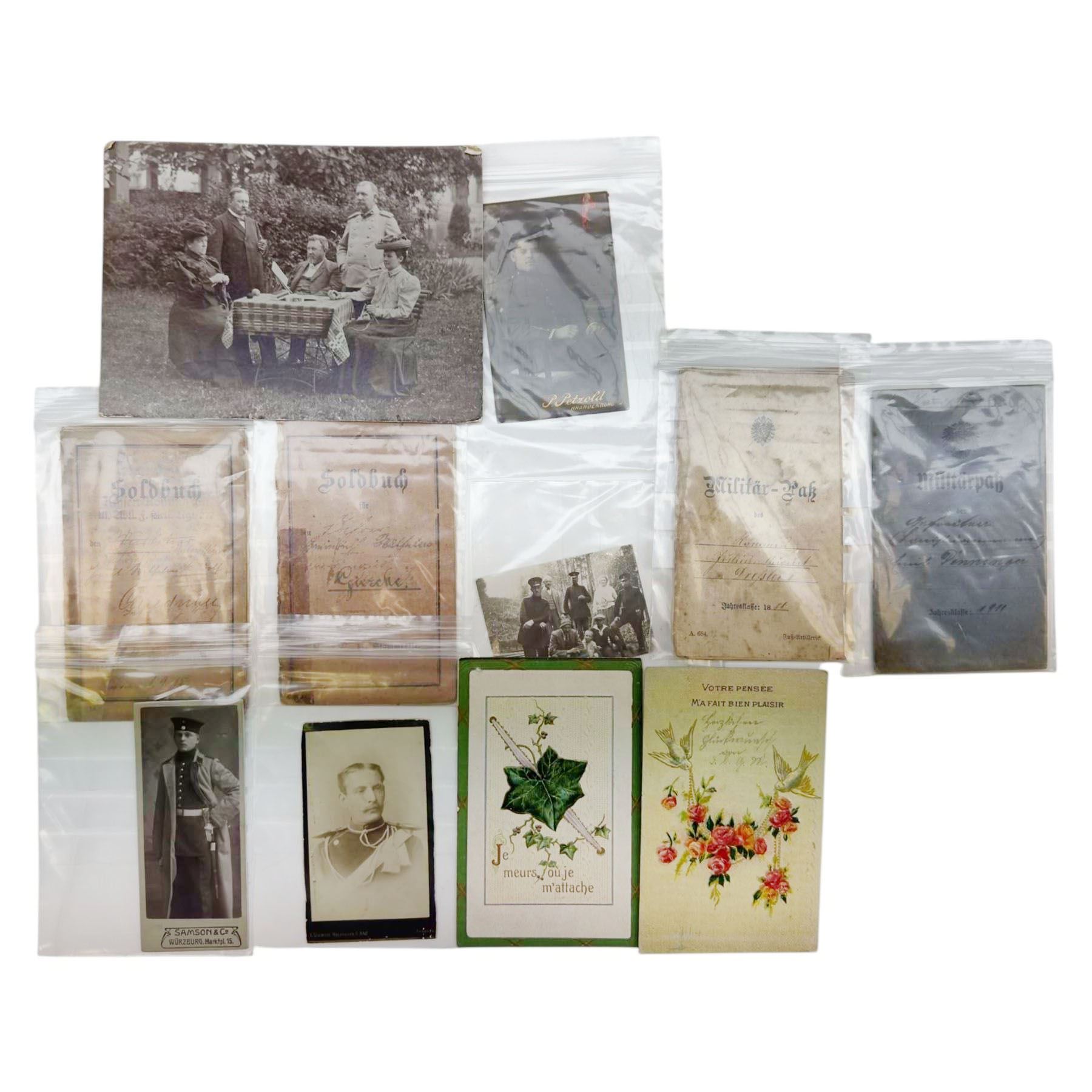 WWI German family grouping ephemera, including photographs, hand written postcards, military passport, Military Anti tank training book  