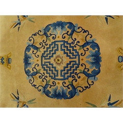  Chinese blue and salmon ground rug, central medallion, repeating border, 373cm x 274cm  