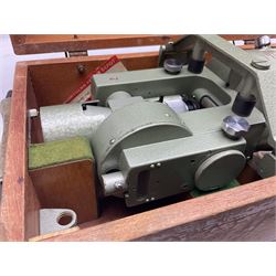 Vickers Instruments England Cooke V22 surveyor's theodolite, No.V.221387, with green enamelled body H32cm; in fitted wooden carrying box with retaining bar and repair label dated 3/8/77.