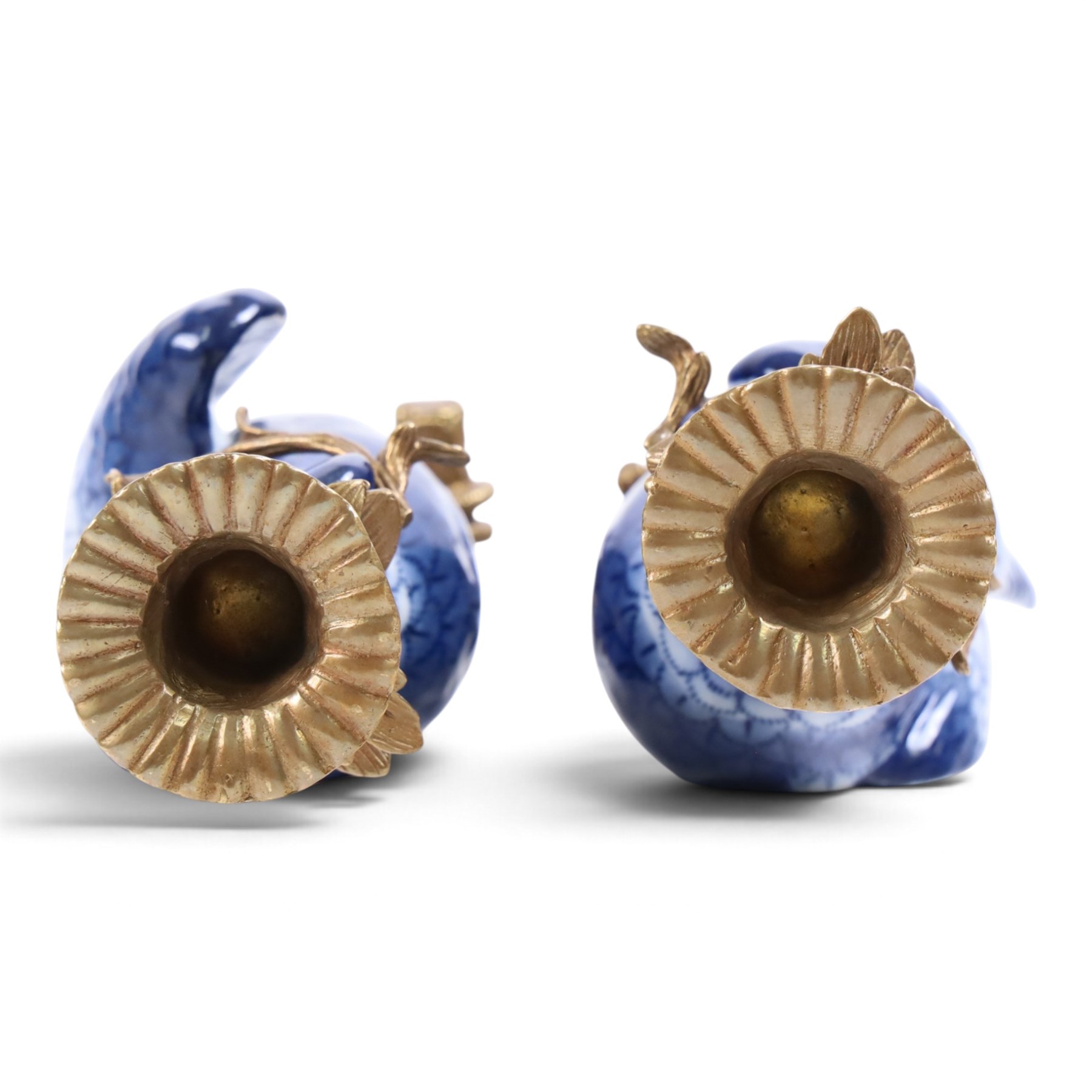 Pair of wall sconces, modelled as blue parrot upon a gilt branch, H47cm