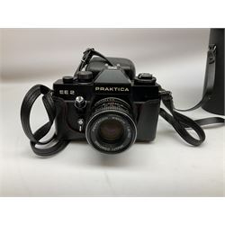 Quantity of Cameras , Lenses and Table Top Viewer- To be assessed 
Collection of cameras, lenses and photography equipment, to include Praktica EE2, Kowa SE, Kodak 66 model II, Inovar, lens Carl Zeiss Jena DDR Flektogon 2.4/35, lens Pentacon Electric f/2.8 135mm, Sunpak auto 2020, tripod  etc, together with a pair of Mark Scheffel 10x50 field binoculars.  