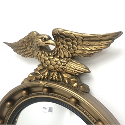  Mid 20th century gilt framed circular eagle mirror, W47cm, H71cm  