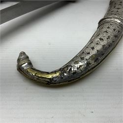 Moroccan jambiya dagger with 24.5cm plain curved blade stamped LONDON to the ricasso area, the hilt and scabbard overlaid with plain sheet brass to the back and ornate silver coloured metal to the front; waisted grip and arched pommel; two pyramid mounts to the scabbard L41cm overall; large billhook with curving blade and stacked leather washer grip; and a reproduction halberd blade (3)