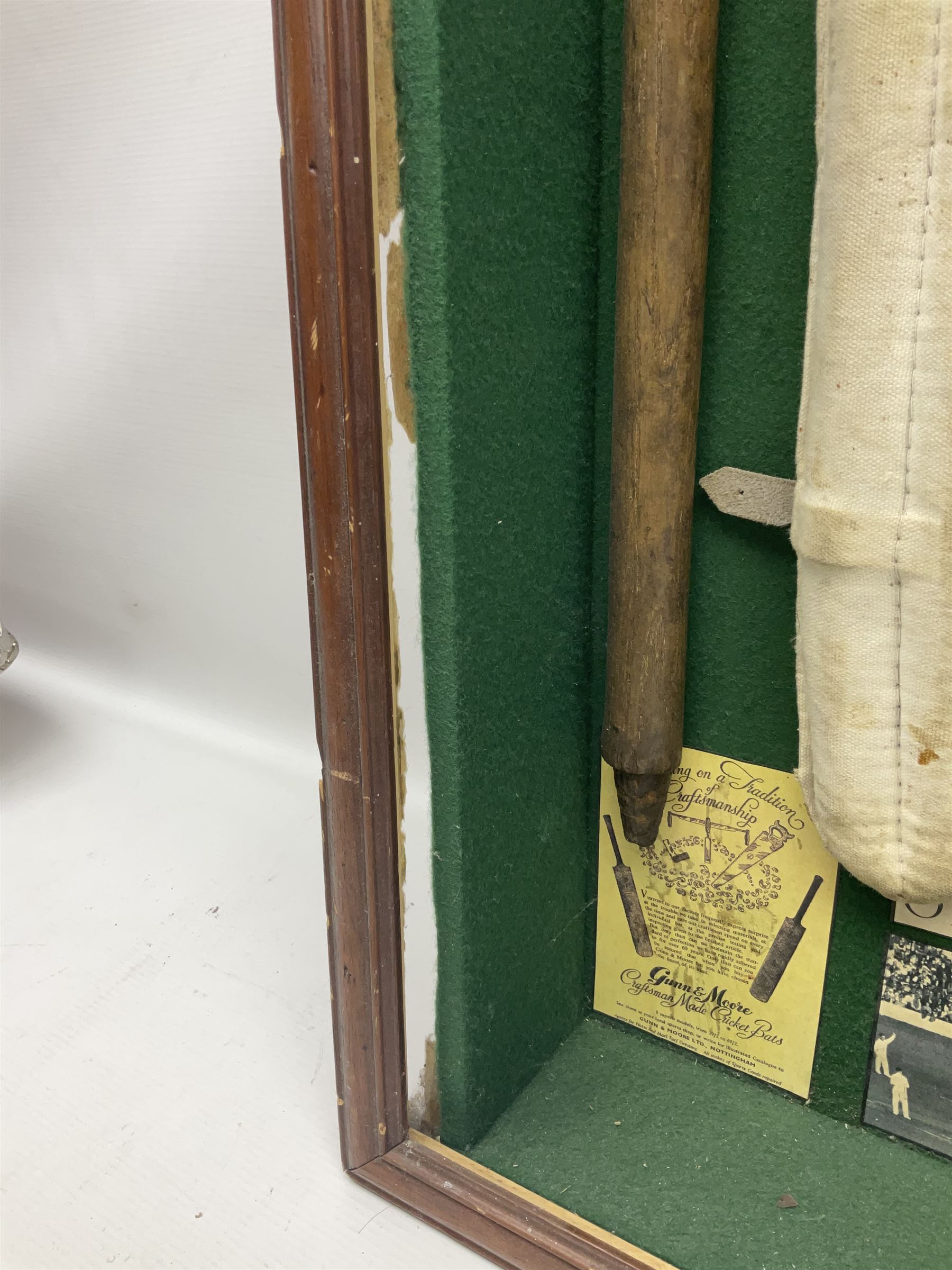 Four framed sporting memorabilia displays, the largest example containing 1930s cricket memorabilia, together with two fishing displays and a football display, each within wooden glazed frames, largest H105cm