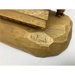 Mid 20th century Paul Caron carved table lamp, modelled as man standing before an oven, the chimney supporting the panelled shade, the base signed P.E. Caron, H42cm