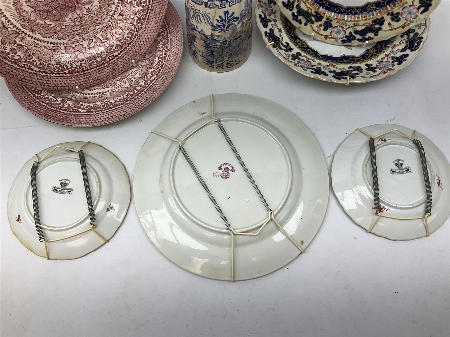 Four mid 19th century Mason's Ironstone plates decorated in the Chinese Antiquities pattern, the central circular panel decorated with footed vase with stylised motifs within a floral border, with gilt detail, pattern no. 1438, largest D26cm, together with Royal Worcester plate with floral decoration within green borders, blue and white tankard with pewter lid and teapot, teapot
