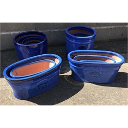  Five graduating glazed ceramic traditional cylinder pots, five egg pots and five traditional troughs (15)  