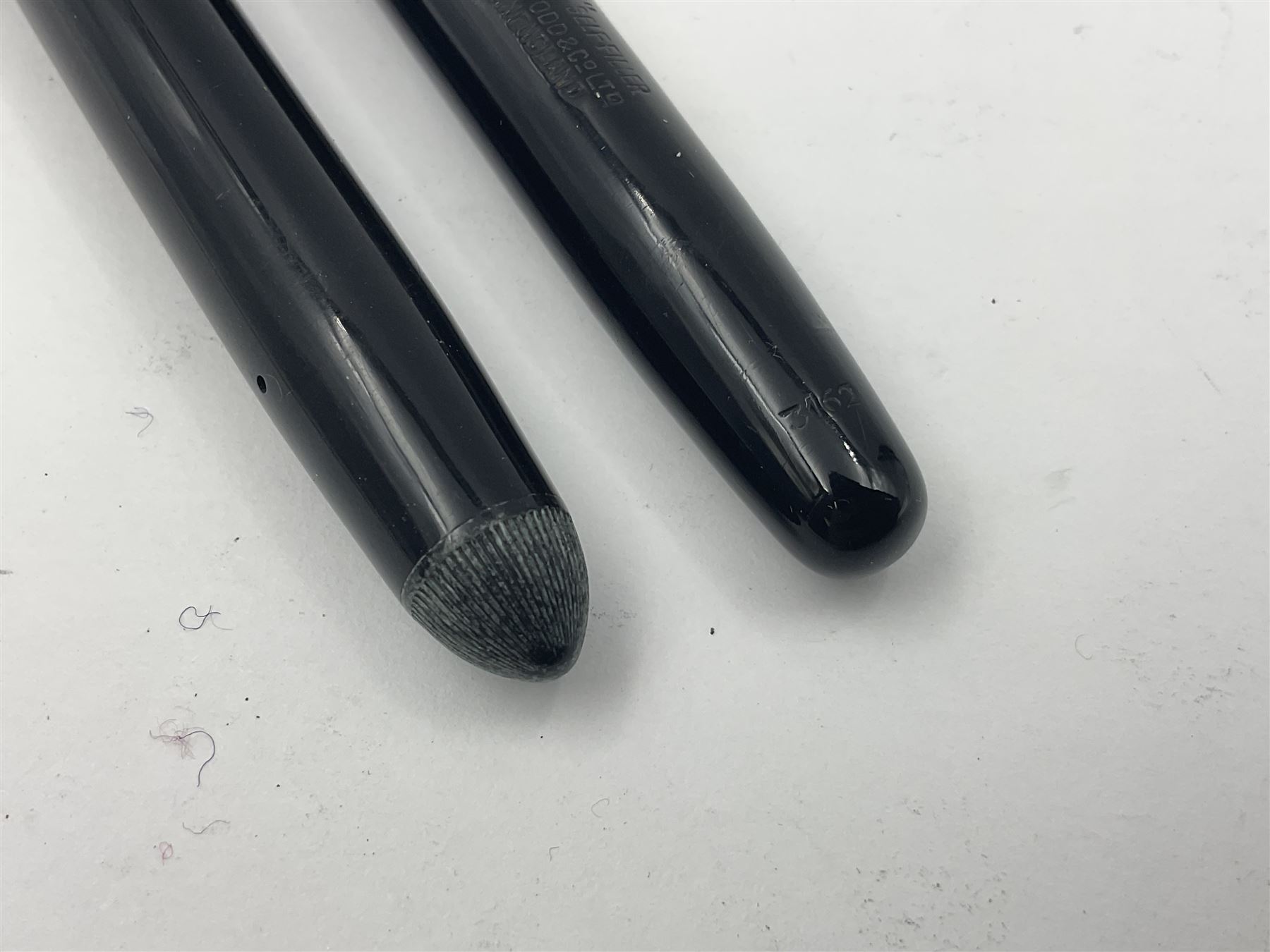 Three Swan Mabie Todd fountain pens, comprising Self Filler 3162 with black barrel and cap with single band and gold nib stamped Eternal 1 14ct, together with two Calligraph examples with gold nibs stamped 14ct, one with box, largest L12.5cm