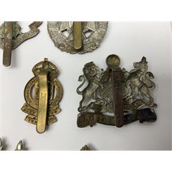 Twenty cap badges including Hertfordshire, Royal Sussex, Cambridgeshire, Hampshire, Notts and Derby, East Surrey, Herefordshire, South Lancashire, Devonshire, Bedfordshire, Durham Light Infantry etc (20)