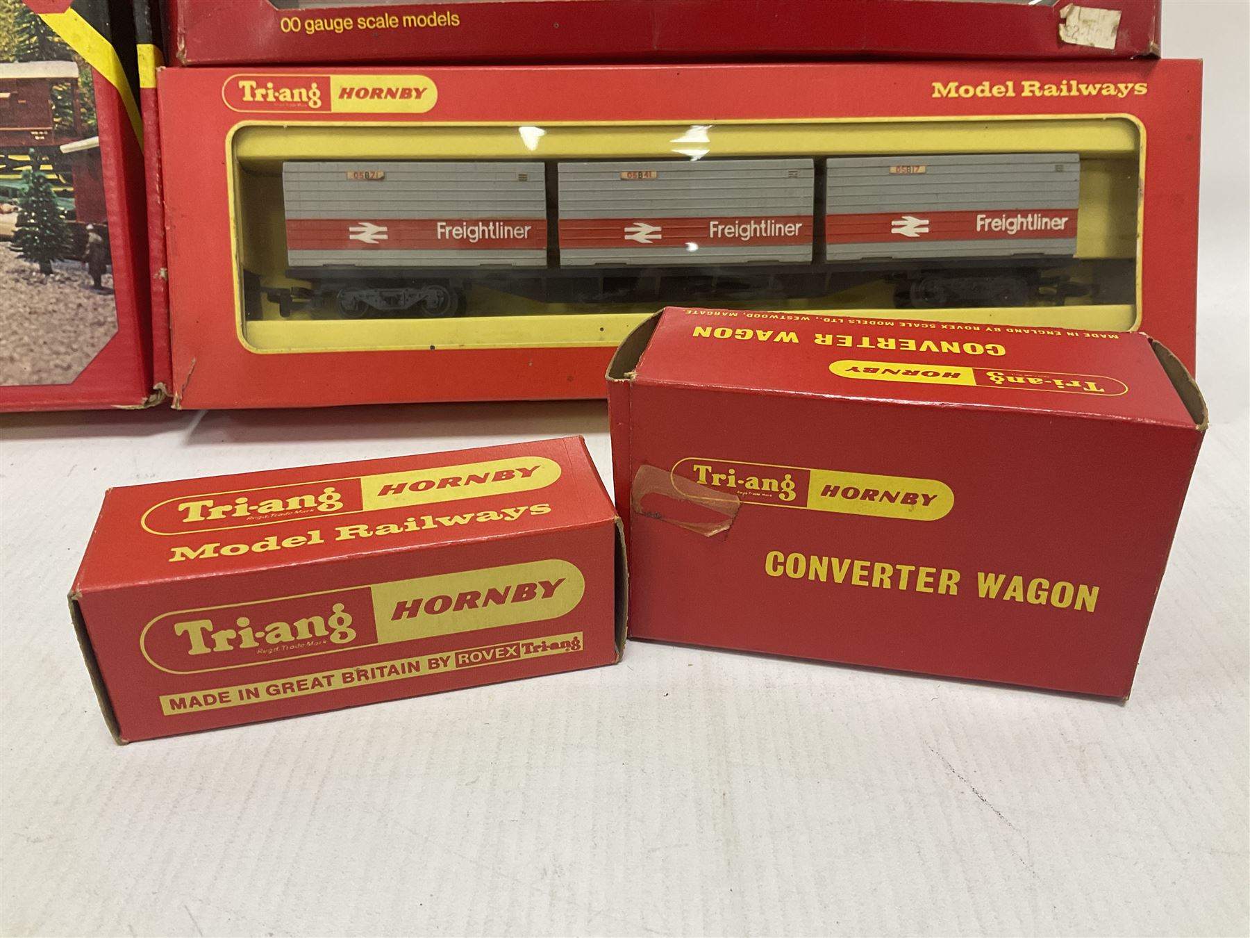 Hornby/Tri-Ang ‘00’ gauge - fifteen goods wagons to include freightliners with containers, ore wagons, closed vans etc; together with R404 Operating ore wagon set; all boxed (16) 
