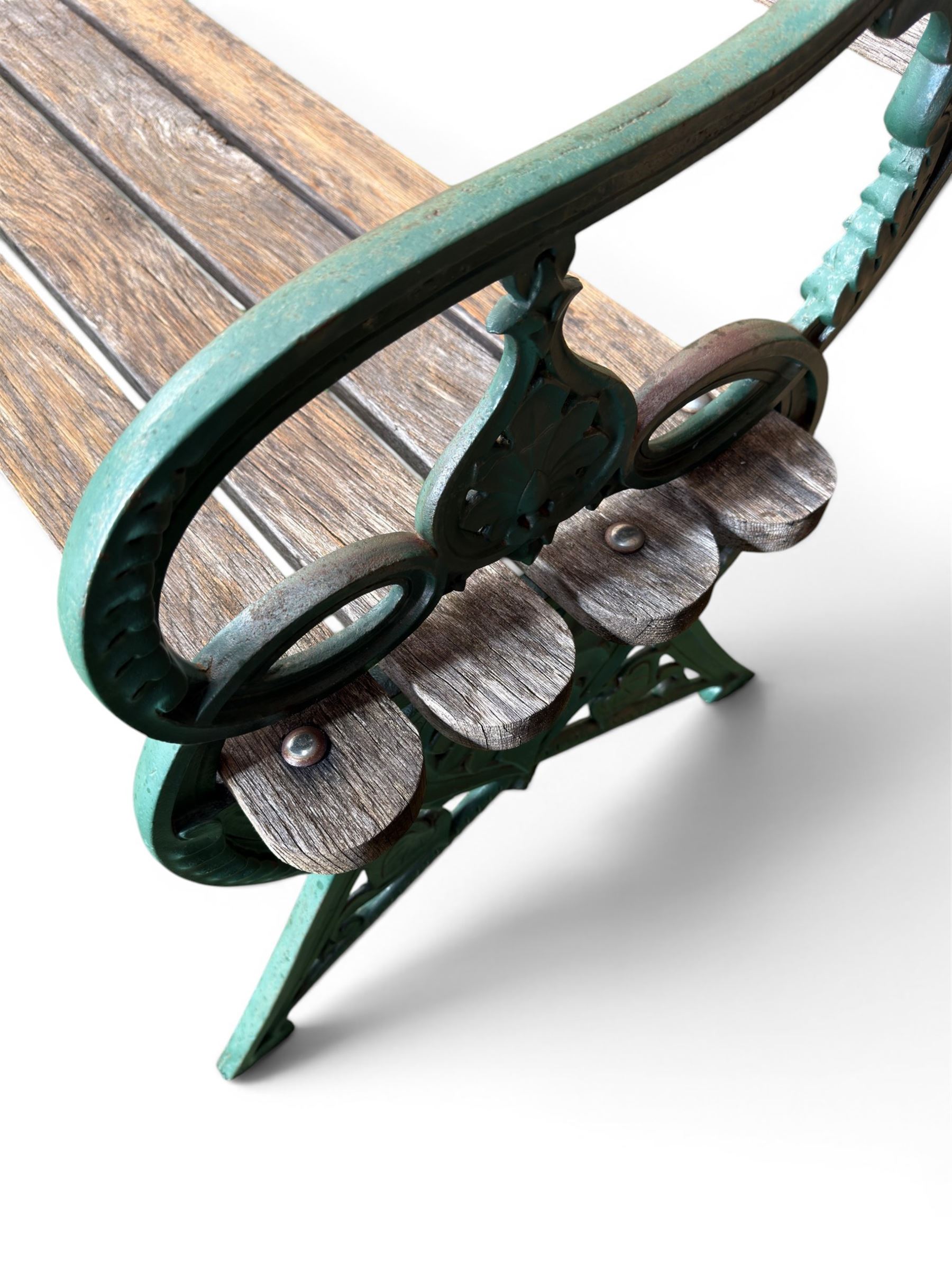 Coalbrookdale - Lily Pad design cast iron an wood slatted garden bench, late 19th century Aesthetic Movement, no. 217569, painted in green with iron centre support and seat stretcher, hardwood slatted