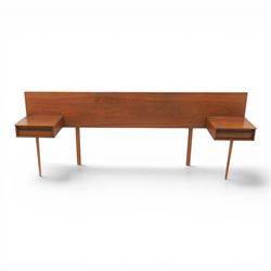 Austinsuite - mid 20th century teak headboard with bedside cabinets and matching  mirrored dressing table, the headboard with floating single drawer bedsides raised on a single tapering support, the dressing table with attached tilting mirror, above rectangular top with kneehole and two banks of two drawers, raised on tapering supports

Headboard H 84cm, D 40cm, W 229cm, W between bedsides 151cm 
Dressing table H 113cm D 44cm, W 149cm, H to underside of dresser 61cm