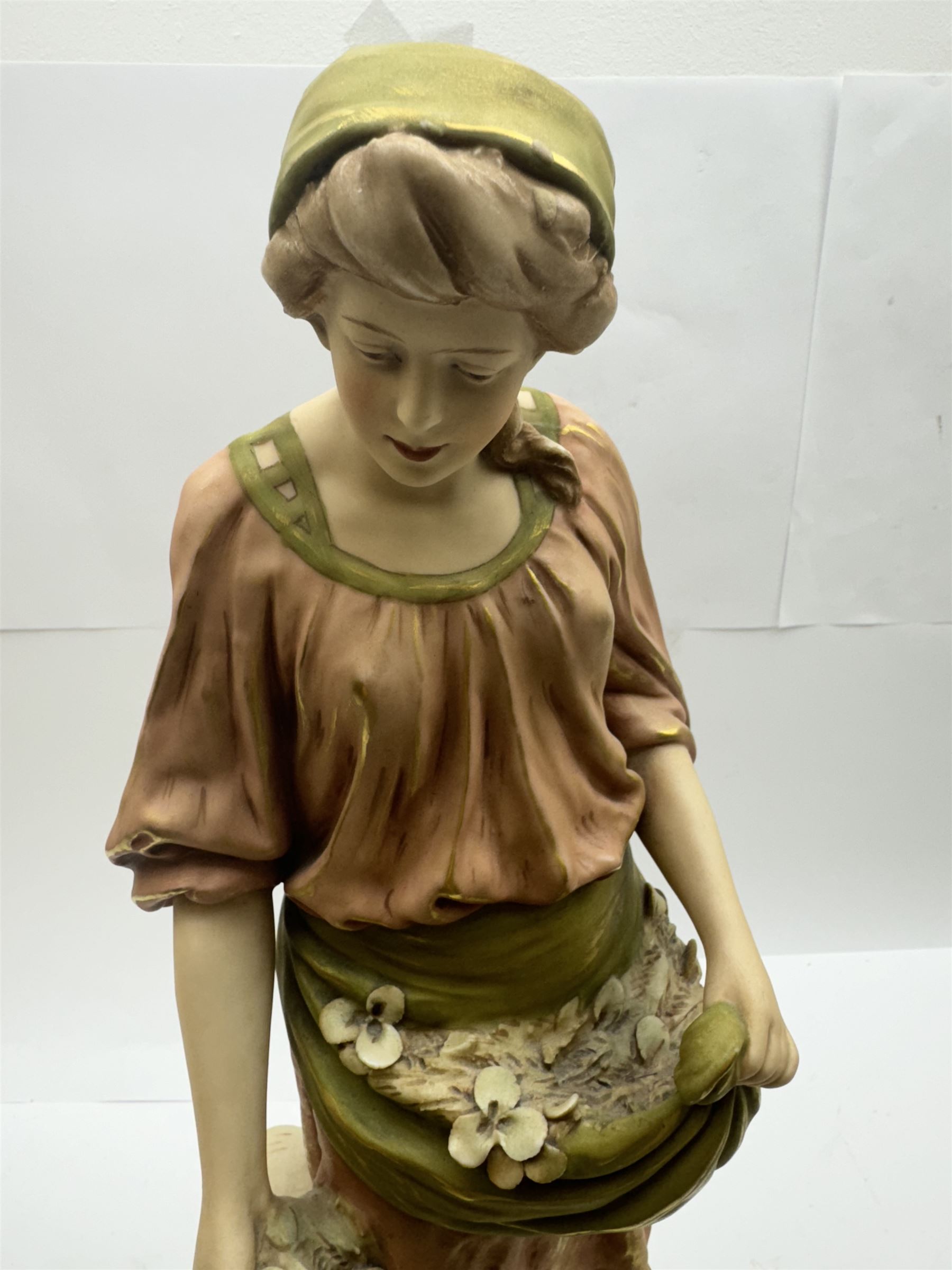 Pair of Royal Dux figures, no. 1115, modelled as a shepherd with a goat by his side and a shepherdess feeding a lamb, each wearing flowing green and pink robes with gilt detailing, with pink triangle mark beneath, H51cm