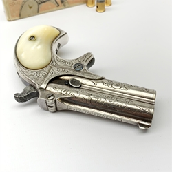 Factory engraved Remington .41 calibre double barrel over and under Derringer, the top of the barrels inscribed 'E. Remington & Sons Ilion. N.Y. Elliot's Patent Dec 12th 1865', with mother-of-pearl split grip, serial no.2695, L13cm overall; with receipt of purchase from Pete Holder dated 08/06/2008; reputedly from the Raymond Kendal collection (former Director of Interpol); with box of  dummy cartridges