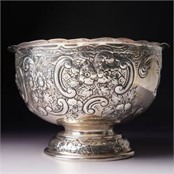 Late Victorian silver bowl embossed with flower heads and scrolls and with vacant cartouches on short pedestal foot D17cm London 1900 Maker Goldsmiths & Silversmiths Company