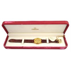 Omega De Ville gentleman's 18ct gold quartz presentation wristwatch, Ref. 73201412, champagne dial with date aperture, on original brown leather strap with gilt buckle, box with warranty card dated 2004