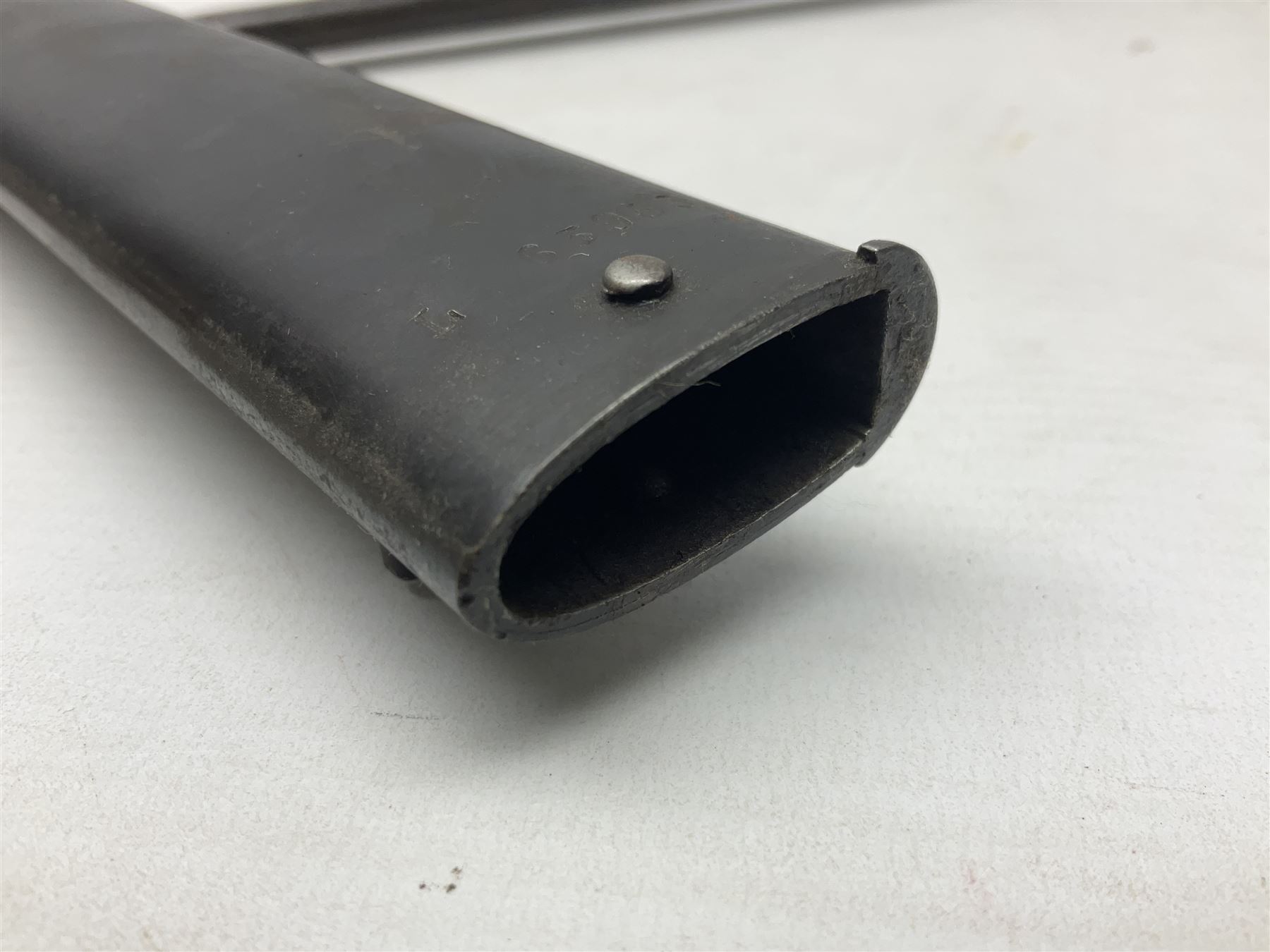 French Model 1866 Chassepot bayonet with 57cm curving fullered steel blade dated 1873 No.L63963; in steel scabbard with conforming number L71.5cm overall; and French St. Etienne Gras bayonet dated 1878 No.K10674 in steel scabbard numbered 79437 (2)