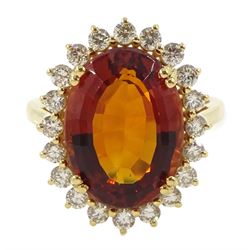 18ct gold citrine and diamond cluster ring, single oval cut citrine of approx 7.35 carat, with round brilliant cut diamond surround, stamped, total diamond weight approx 0.75 carat