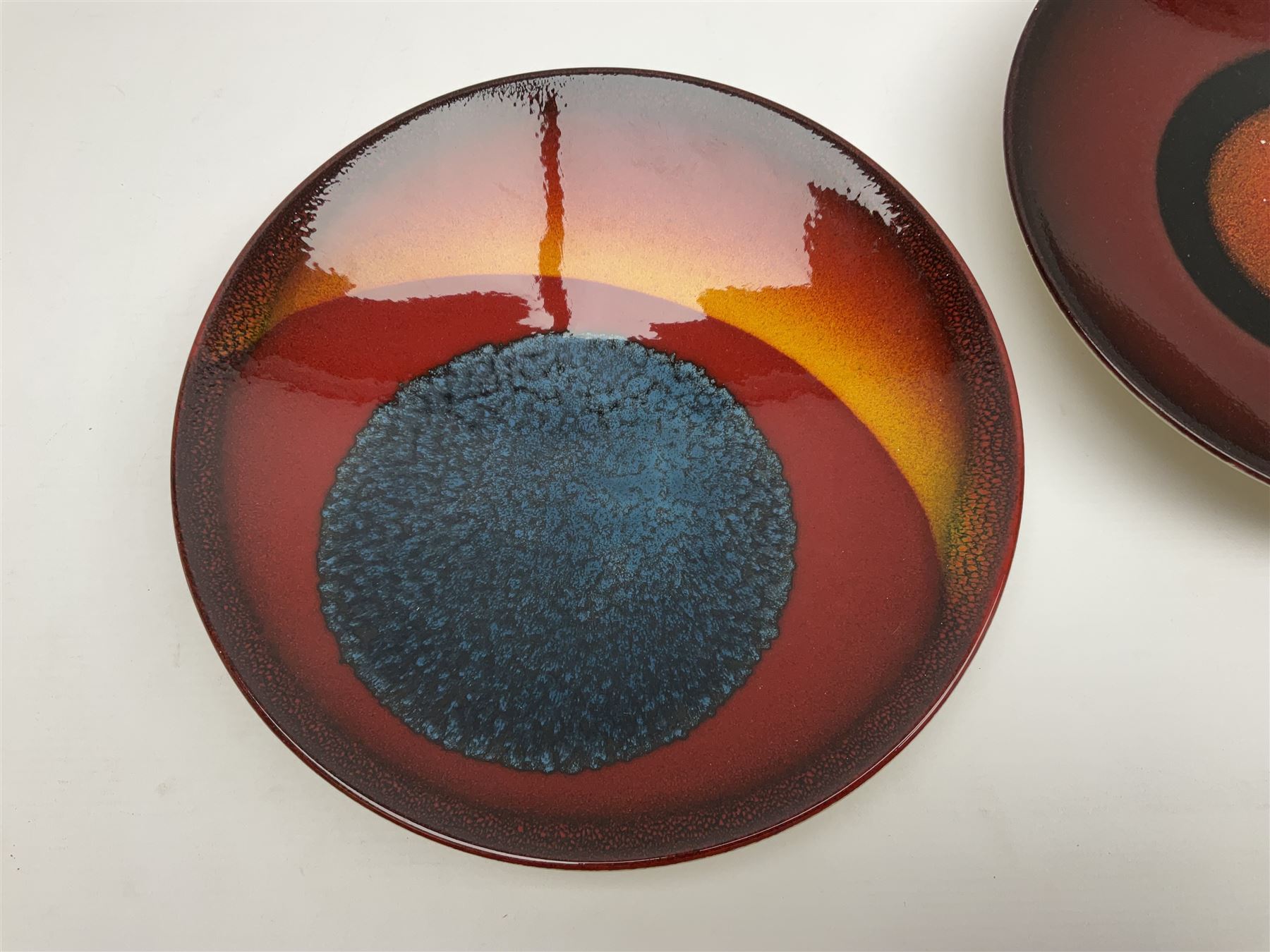 Poole Pottery The Planets, set of nine chargers 'The Planets, by Alan Clarke, comprising Mars, Mercury, Neptune, Venus, Uranus, Pluto, Jupiter, Saturn and Earth, all with original boxes and certificate, D27cm 